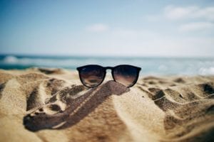 sunglasses on beach sand